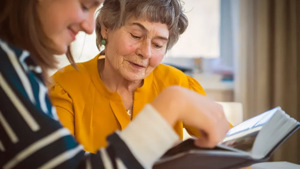 Resident looking at Photo Album