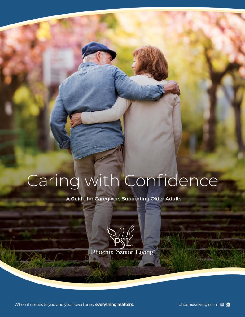 An older couple walks arm in arm up outdoor steps surrounded by blooming trees. Text reads: Caring with Confidence: A Guide for Caregivers Supporting Older Adults. Phoenix Senior Living..