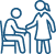 Caregiver and parent assisting a child in a wheelchair at a table.